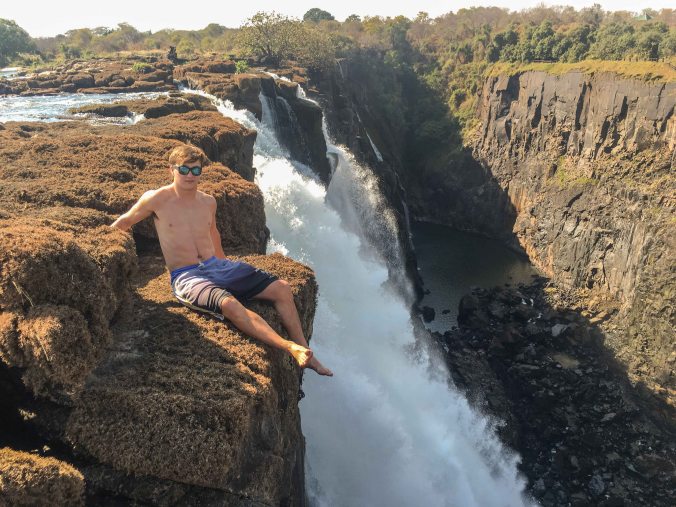 Casey above the falls on a ledge