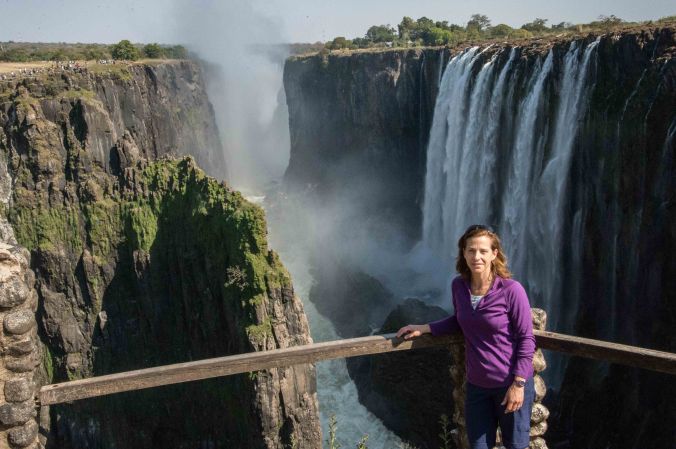 Sarah with Victoria Falls behind her