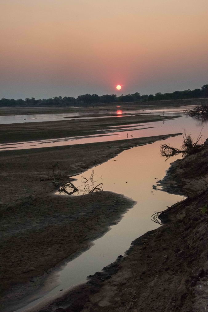 Sun setting over the Luangwe River