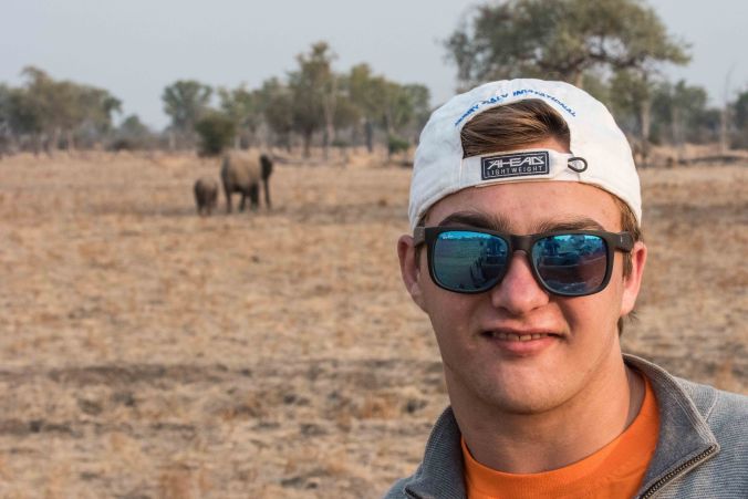 Casey with elephants behind him