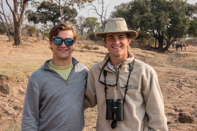 Casey and Tyler posing with the elephant behind them on our walking safari