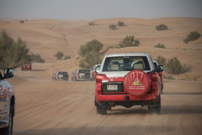 headed into the desert with a caravan of SUVs