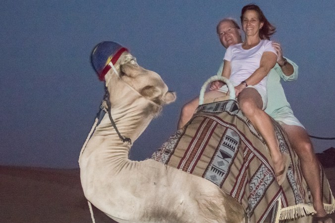Sarah and Charlie riding the camel