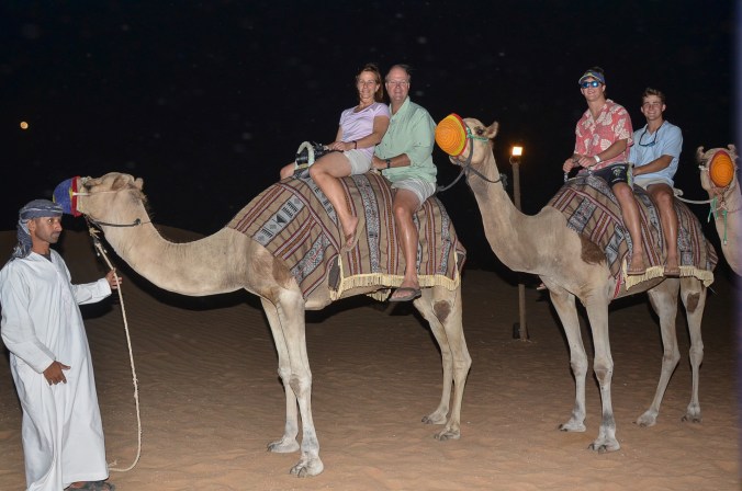 family shot on the camels at the bedouin camp